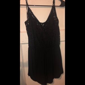 Black romper with design on back